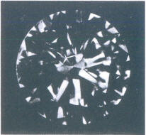 Fig 90 Light crack in several pavilion facets. seen through crown 