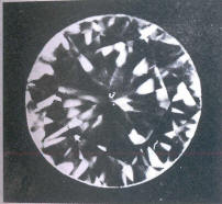 Fig 93 Several light inclusions under the table and crown facets 