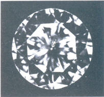 Fig 98 One dark and several light crystals under the table and crown facet 