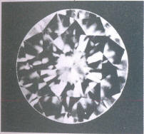 A pinpoint inclusion under a girdle facet