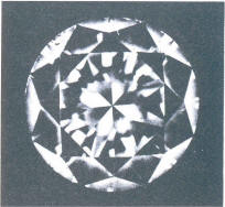 A tiny cleavage crack at the girdle, penetrating into a crown main facet