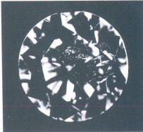 Fig 112 Fine Cracks in the shape of a cloud under the table and crown facets Fig 112 Fine Cracks in the shape of a cloud under the table and crown facets