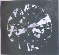 Fig 135 Larger cleavage crack under crown facets starting at the girdle Fig 135 Larger cleavage crack under crown facets starting at the girdle