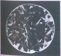 Fig 137 Larger cracks under the table and crown facets Fig 137 Larger cracks under the table and crown facets
