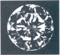 Fig 58 Three pinpoint crystals under the table, crack like fringes