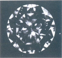 Fig 74 Several very small, light inclusions under the crown facets Fig 74 Several very small, light inclusions under the crown facets