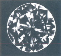 Fig 76 A very small crystal inclusion under the table and table facet, fringe-like cracks Fig 76 A very small crystal inclusion under the table and table facet, fringe-like cracks