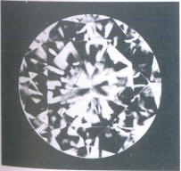 Fig 83 Two small light crystal inclusions under the table Fig 83 Two small light crystal inclusions under the table