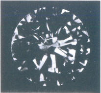 Fig 90 Light crack in several pavilion facets. seen through crown Fig 90 Light crack in several pavilion facets. seen through crown