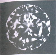 Fig 97 Cloud and small crystal under the table. small crack in crown girdle facet Fig 97 Cloud and small crystal under the table. small crack in crown girdle facet